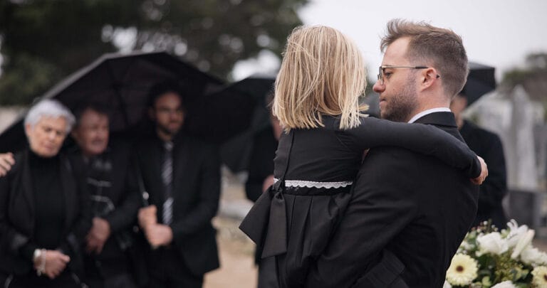 Father and daughter at a funeral