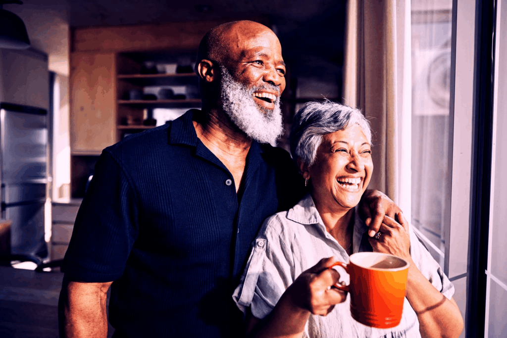 Old couple looking out the window